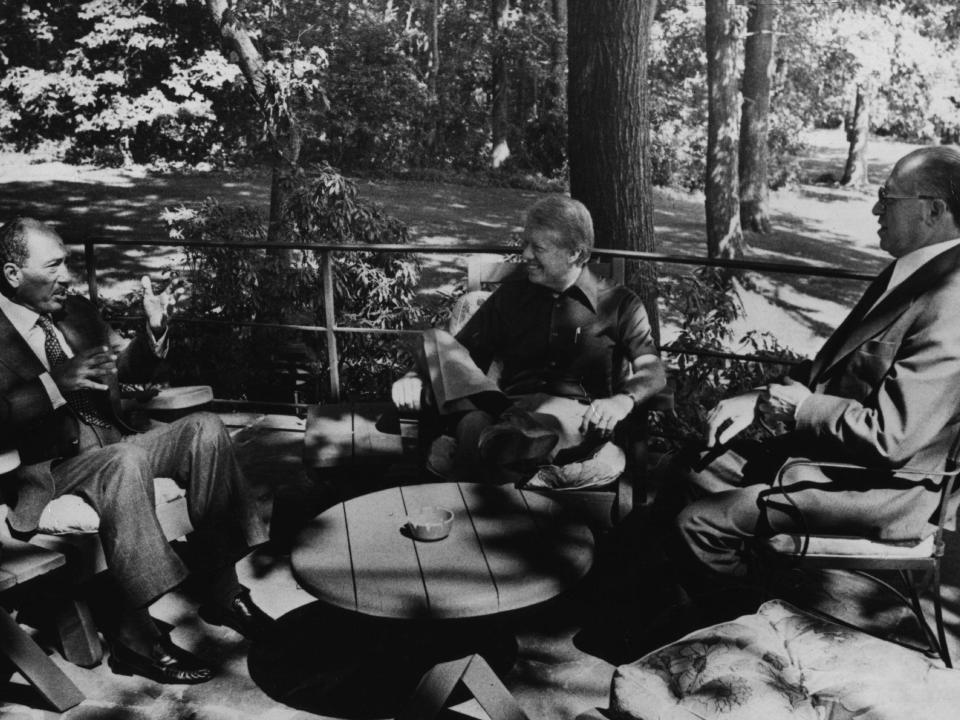 Mohamed Anwar al-Sadat and Menachem Begin and jimmy carter