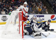 Carolina Hurricanes forward Jordan Staal, left, watches as teammate forward Jesper Fast scores past Columbus Blue Jackets goalie Joonas Korpisalo, center, during the first period of an NHL hockey game in Columbus, Ohio, Saturday, Oct. 23, 2021. (AP Photo/Paul Vernon)