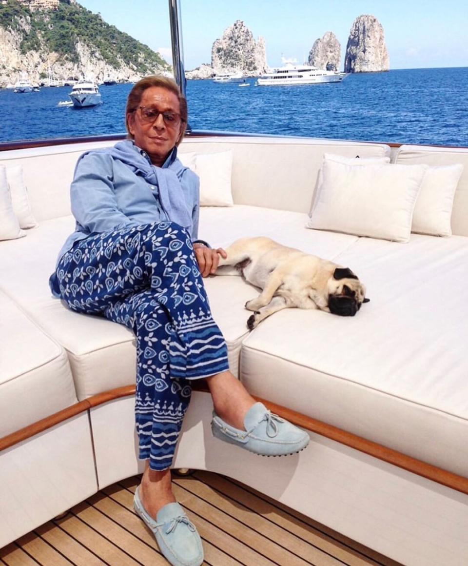 Designer Valentino Garavani and his pug seem to share a love of sunbathing on yachts.