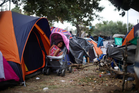 A migrant girl, part of a caravan of thousands from Central America trying to reach the United States, rests in a temporary shelter in Tijuana, Mexico, November 28, 2018. REUTERS/Hannah McKay