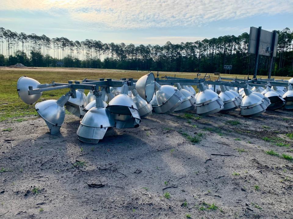 Stadium lights lie on the ground where the city dismantled a complex of three softball fields at Taye Brown Regional Park to make room for construction of the new fairgrounds site. The cleared space is part of the area where the city and the Greater Jacksonville Fair Association will build the new fairgrounds on the Westside.