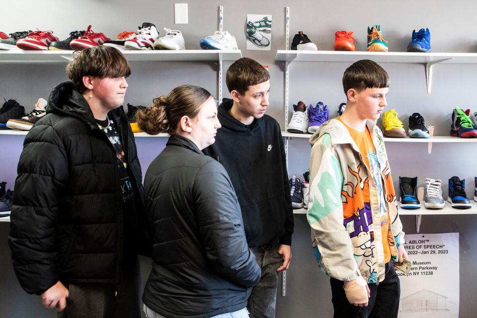 Customers form a line at the register of Ryan Johnson's 10kthelongway sneaker store in Newark, Monday, February 20, 2023. Johnson has been reselling shoes since he was a teen and is the creator of the SneakPeekConvention that will be held at Stubbs Early Education Center in Wilmington on Feb. 25. 