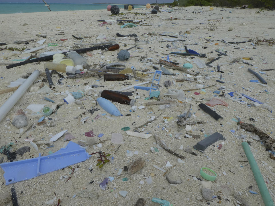 In this April 9, 2021 photo provided by Matt Saunter, marine debris including plastic covers the beach on Midway Atoll in the Northwestern Hawaiian Islands. A crew has returned from the remote Northwestern Hawaiian Islands with a boatload of marine plastic and abandoned fishing nets that threaten to entangle endangered Hawaiian monk seals and other marine animals on the tiny, uninhabited beaches stretching for more than 1,300 miles north of Honolulu. (Matt Saunter, Papahanaumokuakea Marine Debris Project via AP)