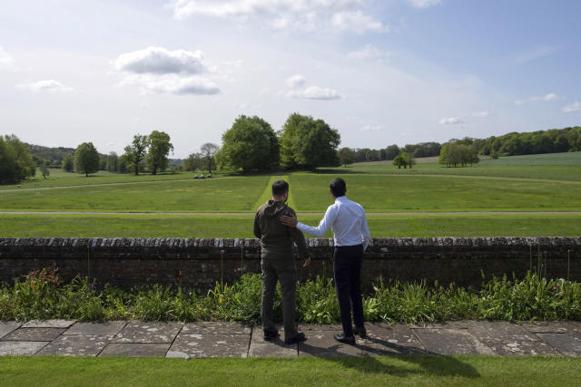 FILE - Britain's Prime Minister Rishi Sunak, right, and Ukraine's President Volodymyr Zelenskyy, look out towards trees planted by Winston Churchill as they walk in the garden at Chequers, the prime minister's official country residence, in Aylesbury, England, Monday, May 15, 2023. While the world awaits Ukraine's spring offensive, its leader Volodymyr Zelenskyy has already launched a diplomatic one. In a span of a week, he has dashed to Italy, the Vatican, Germany, France and Britain to shore up support for the defense of his country. On Friday, May 19, 2023, he was in Saudi Arabia to meet with Arab leaders, some of whom are allies with Moscow. (Carl Court/Pool via AP, File)