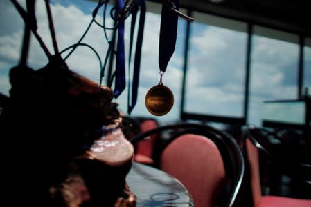 A medal hangs on a sculpture during the Caribbean qualifying round for the Tango World Championship in Buenos Aires, in Havana