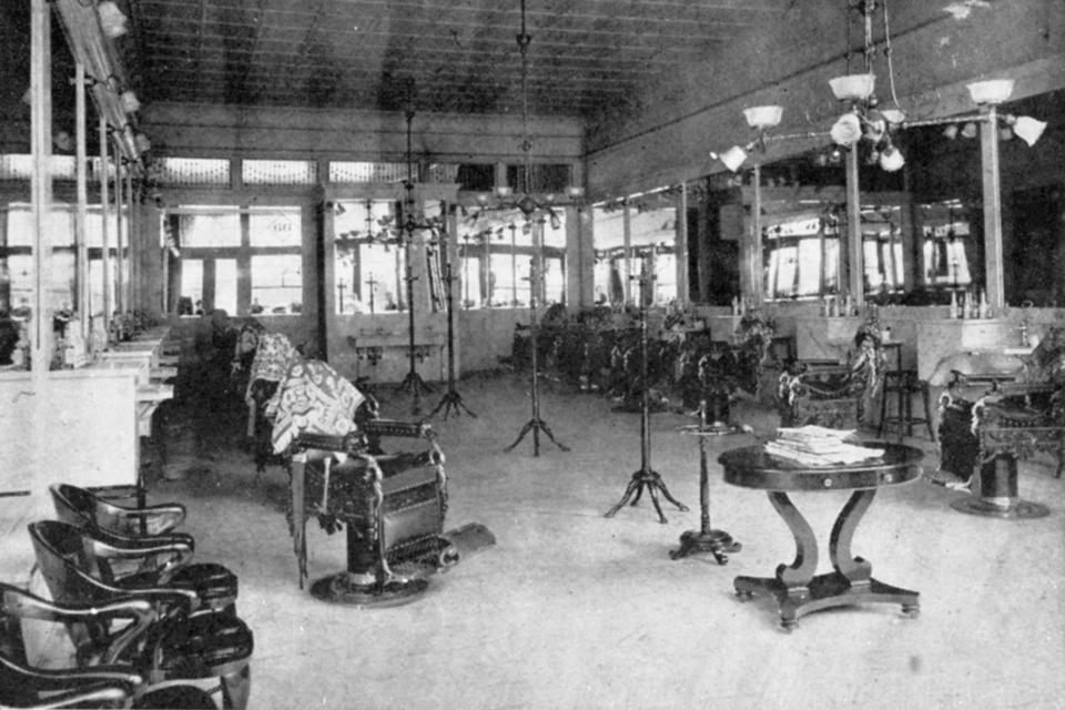 This photo provided by the Kenan Research Center at the Atlanta History Center shows the interior of A. F. Herndon's Barber Shop in Atlanta, Ga. Herndon was one of Atlanta’s first Black millionaires and his shop was one of the first business to be destroyed by white mobs during the 1906 Atlanta Race Massacre. Few have been taught about the massacre, which forced thousands from their homes and shaped the city’s geography, economy, society and power structure in lasting ways. (Courtesy of Kenan Research Center at the Atlanta History Center via AP)