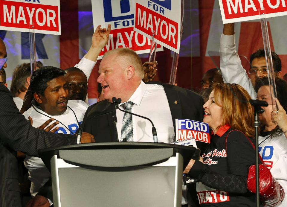 Toronto Mayor Rob Ford is surrounded by supporters on the podium after his address during his campaign launch party in Toronto, April 17, 2014. Ford is seeking re-election in the Toronto municipal election, set for October 27, 2014.