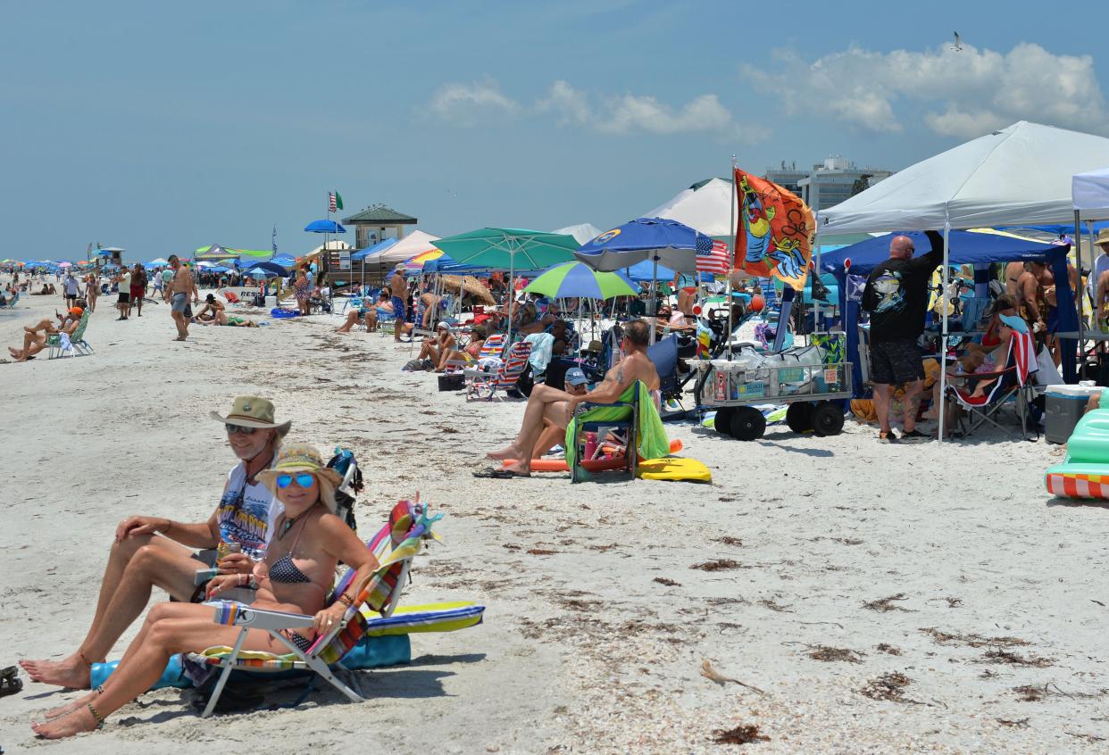 Spectators on Lido Beach watch the 39th annual Sarasota Powerboat Grand Prix, in July. Summer months are a prime time for the presence of Vibrio vulnificus bacteria in area waters. Two people contracted a related illness, Vibriosis in Sarasota County earlier this year – one in May and one in June. One of them ultimately died.