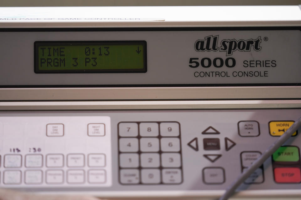 The pitch clock is operated in the press box during the sixth inning of a spring training baseball game between the San Diego Padres and the Los Angeles Dodgers in Glendale, Calif., Monday, March 6, 2023. (AP Photo/Ashley Landis)