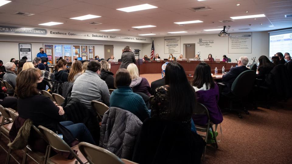 Central Bucks School District's board of directors listen to comments at a public meeting in January over COVID-19 rules. This week saw another heated meeting draw crowds as one group's push to remove books in the district has begun.