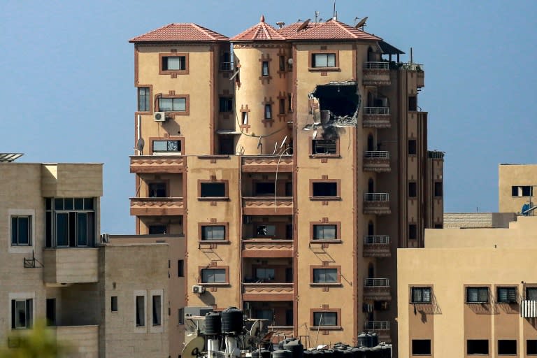 A gaping hole is shown on November 3, 2023 in the Hajji building which houses Agence France Presse (AFP) news bureau in Gaza City, amid the ongoing battles between Israel and the Palestinian group Hamas (Bashar TALEB)