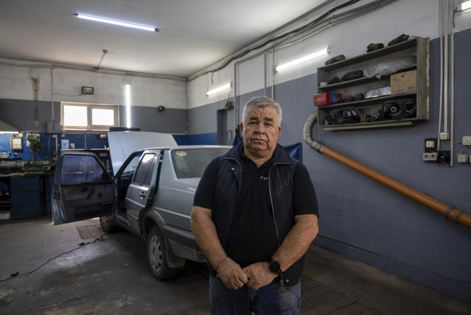 Oleksii, 68, director of the auto repair shop poses for photo in Kyiv region, Ukraine, Saturday, May 18, 2024. A divisive mobilisation law in Ukraine came into force on Saturday, as Kyiv struggles to boost troop numbers after Russia launched a new offensive. (AP Photo/Alex Babenko)