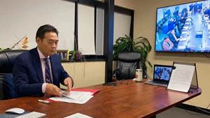 Noah Digital Group Chairman Dr. Bin Tang signing the agreement