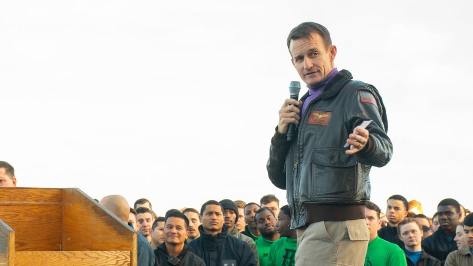 Capt. Brett Crozier, then-commanding officer of the aircraft carrier Theodore Roosevelt, talks with his sailors during an all-hands call on the flight deck Dec. 15, 2019. (MCSN Alexander Williams/Navy via Getty Images)