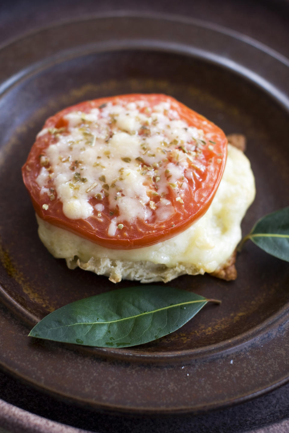 In this image taken on April 1, 2013, an English muffin broiled cheese and tomato sandwich is shown in Concord, N.H. (AP Photo/Matthew Mead)