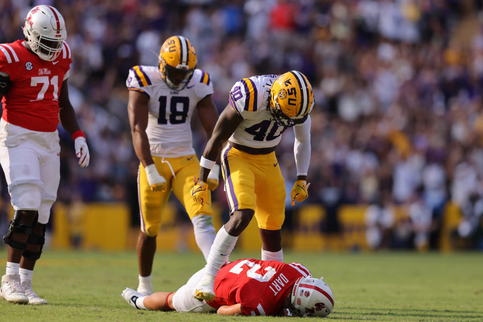 BATON ROUGE, LOUISIANA – OCTOBER 22: Harold Perkins Jr. #40 of the <a class="link " href="https://sports.yahoo.com/ncaaf/teams/lsu/" data-i13n="sec:content-canvas;subsec:anchor_text;elm:context_link" data-ylk="slk:LSU Tigers;sec:content-canvas;subsec:anchor_text;elm:context_link;itc:0">LSU Tigers</a> reacts after sacking <a class="link " href="https://sports.yahoo.com/ncaaf/players/322381" data-i13n="sec:content-canvas;subsec:anchor_text;elm:context_link" data-ylk="slk:Jaxson Dart;sec:content-canvas;subsec:anchor_text;elm:context_link;itc:0">Jaxson Dart</a> #2 of the Mississippi Rebels during the first half at Tiger Stadium on October 22, 2022 in Baton Rouge, Louisiana. (Photo by Jonathan Bachman/Getty Images)