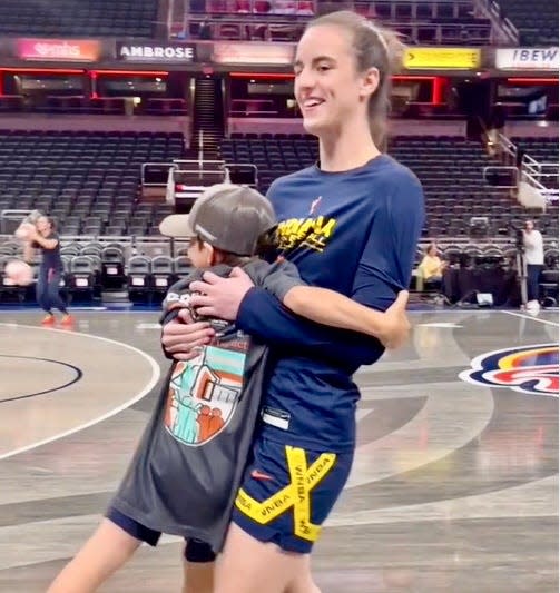 Eli Krost reunites with Indiana Fever star Caitlin Clark Sunday. The Krost family was given courtside seats to the game after Eli went viral for getting his shot blocked by Clark as his Habitat for Humanity home was being built.