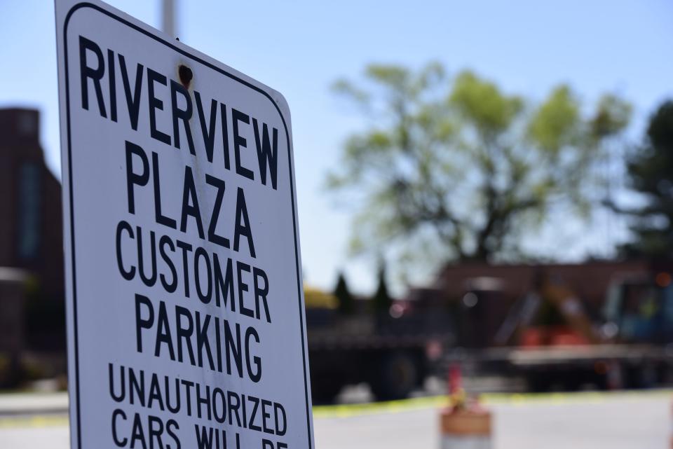 Reconstruction work of the aged parking lot around Riverview Plaza gets underway in downtown St. Clair on Monday, May 9, 2022.