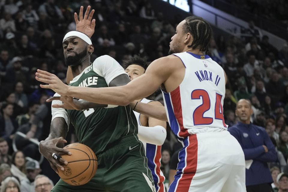 Detroit Pistons' Kevin Knox II fouls Milwaukee Bucks' Bobby Portis during the first half of an NBA basketball game Saturday, Dec. 16, 2023, in Milwaukee. (AP Photo/Morry Gash)