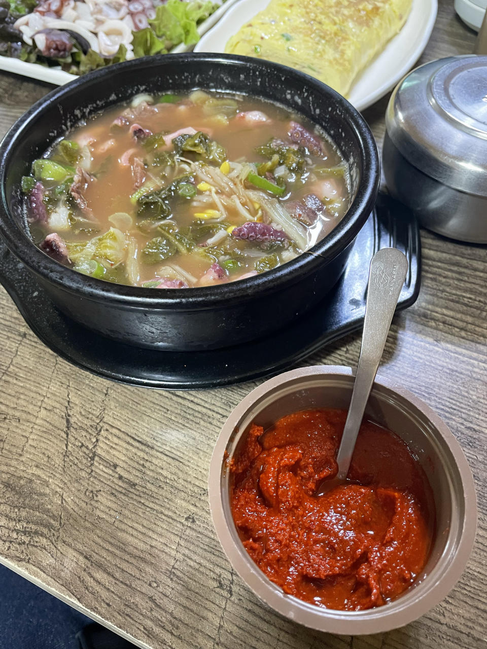 The octopus rice soup tastes better if you add the chilli paste. (Photo: Lim Yian Lu)