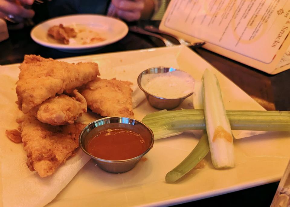 buffalo blast on plate at cheesecake factory with hot sauce and celery