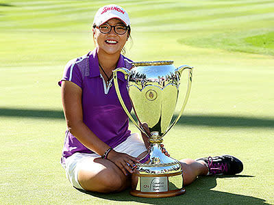 The Kiwi up and comer poses with her trophy after winning the 2013 Canadian Women's Open at The Vancouver Golf Club.
