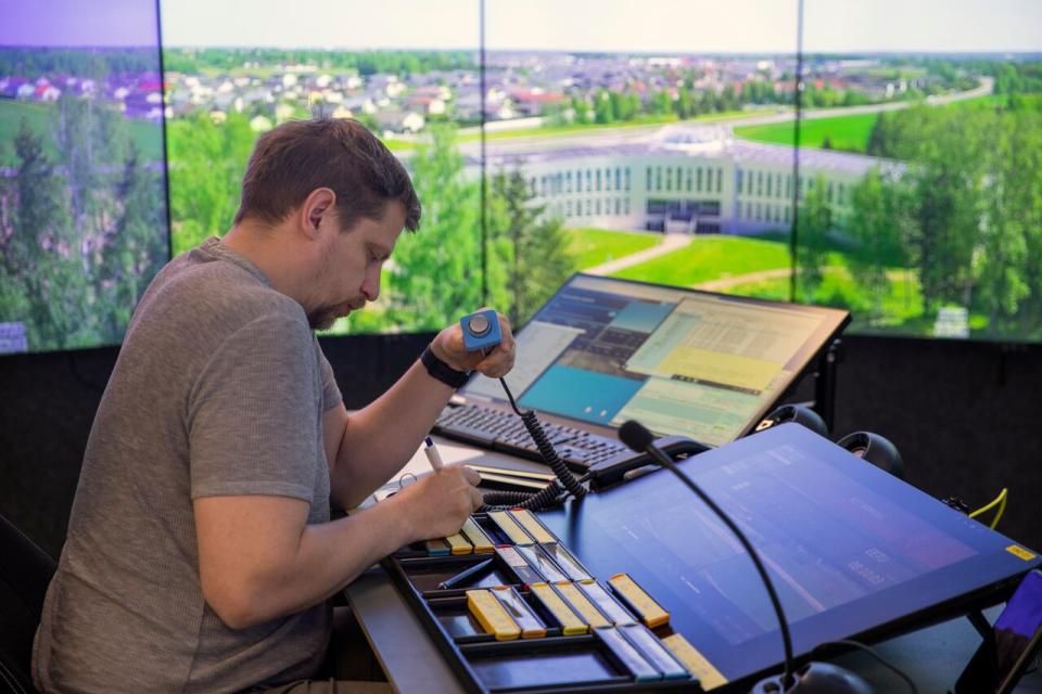 A flight information services officer oversees the Tartu airport through a remote live stream that is broadcast in Tallinn. Airport officials tell CBC news they are seeing a major spike in reports of GPS jamming. 