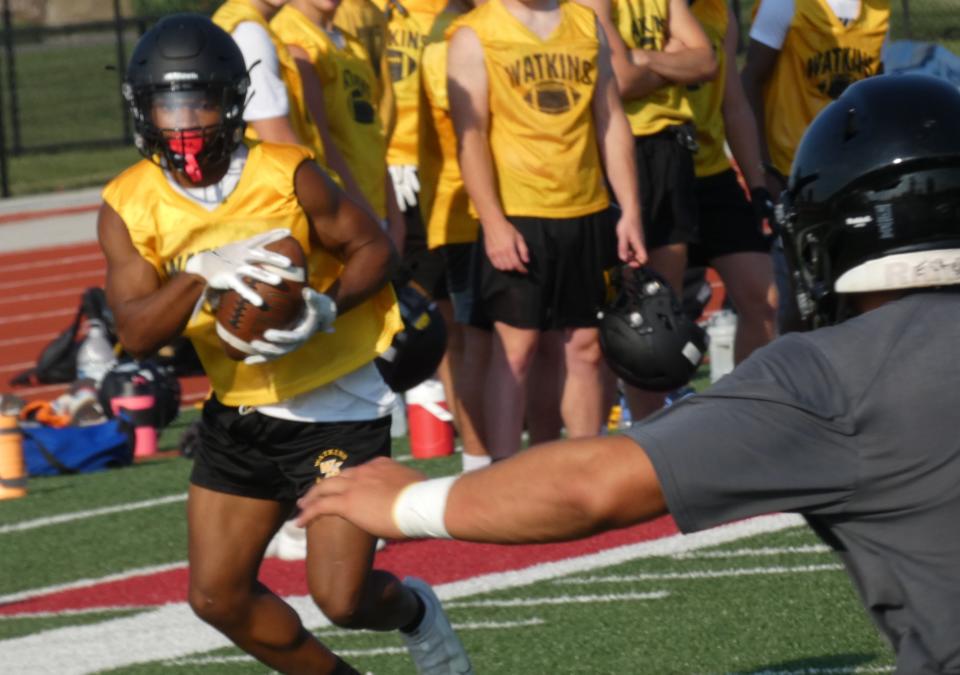 Watkins Memorial senior DaaVion Long moves upfield after catching a pass in the flat against Franklin Heights during a passing scrimmage at Lakewood on Tuesday, July 19, 2022.