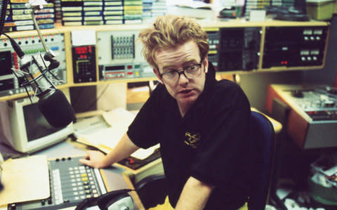 DJ Chris Evans in the BBC Radio 1 studios in London, England in November 1995 - Credit: Kevin Cummins/ Getty Images Contributor