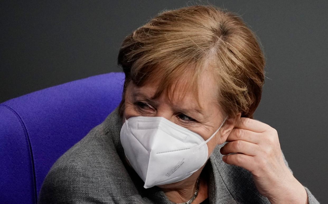 German Chancellor Angela Merke attends a plenary session on the current developments of the coronavirus pandemic in Germany, at the parliament Bundestag in Berlin, Germany, Wednesday, Jan. 13, 2021. (Michael Kappeler/dpa via AP) - Michael Kappeler/DPA