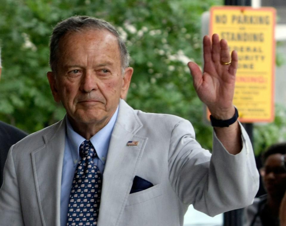 U.S. Sen. Ted Stevens, R-Alaska, waves to cameras as he arrives at a U.S. district court for an arraignment July 31, 2008 in Washington, D.C.