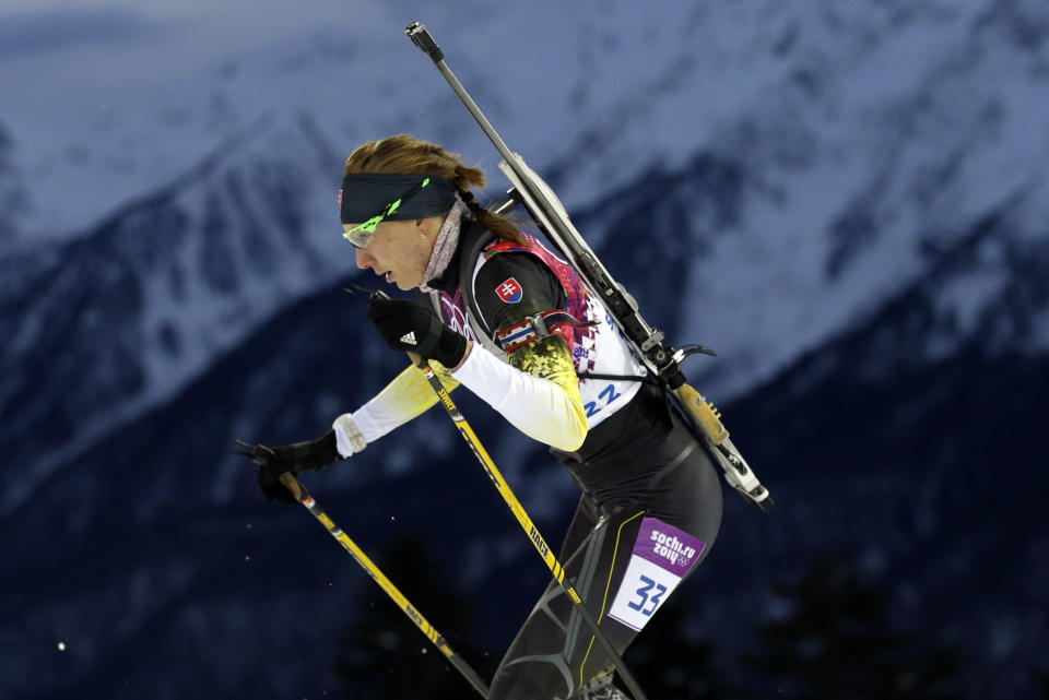 Slovakia's Anastasiya Kuzmina competes to win the gold medal in the women's biathlon 7.5k sprint, at the 2014 Winter Olympics, Sunday, Feb. 9, 2014, in Krasnaya Polyana, Russia. (AP Photo/Felipe Dana)