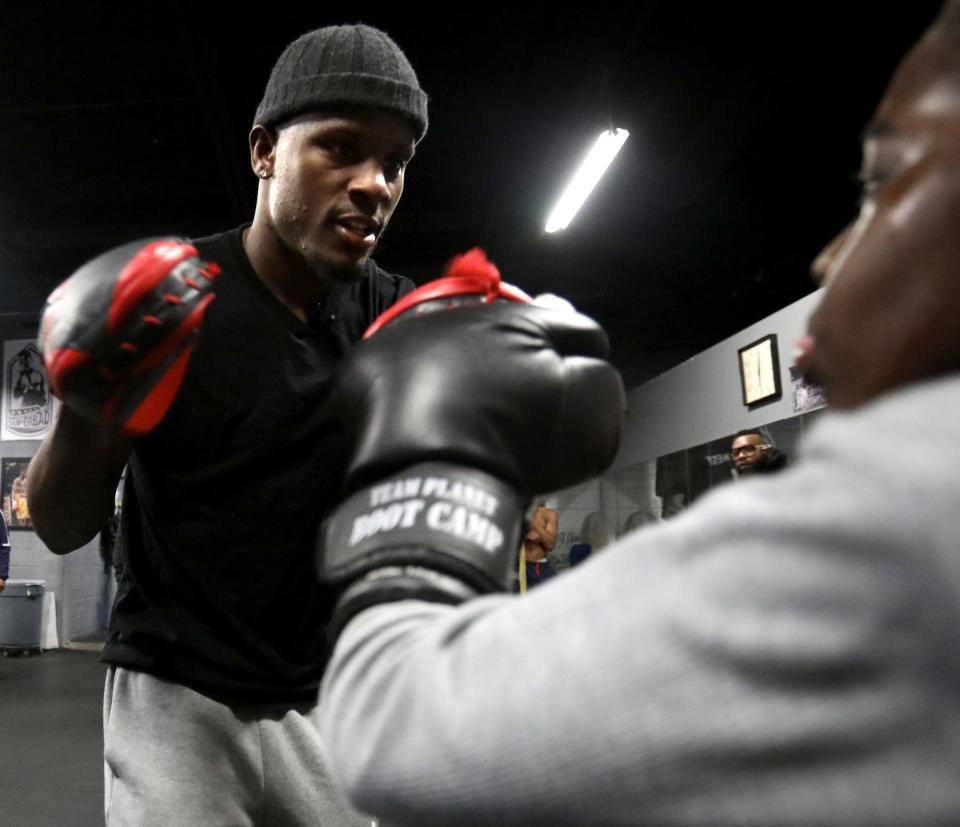 Tony Harrison spares with one of many kids that come to his gym, Superbad Fitness in Detroit, on Thursday, Jan. 10, 2019.