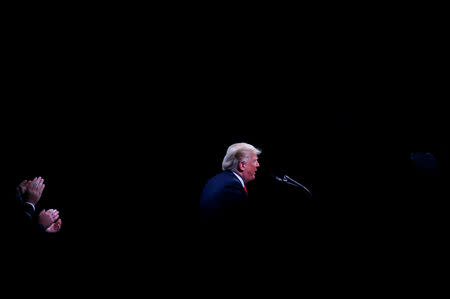 U.S. President Donald Trump speaks at the International Association of Chiefs of Police Annual Convention at the Orange County Convention Center in Orlando, FL, U.S., October 8, 2018. Reuters photographer Leah Millis: "I took this photograph as the pool was being ushered out to leave right before Trump's speech was supposed to end. These are the images we take after we have taken the literal, newsy ones." REUTERS/Leah Millis