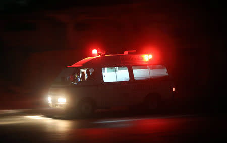 Aamin ambulance drives from the scene of an explosion near the Presidential palace in Mogadishu, Somalia February 23, 2018. REUTERS/Feisal Omar