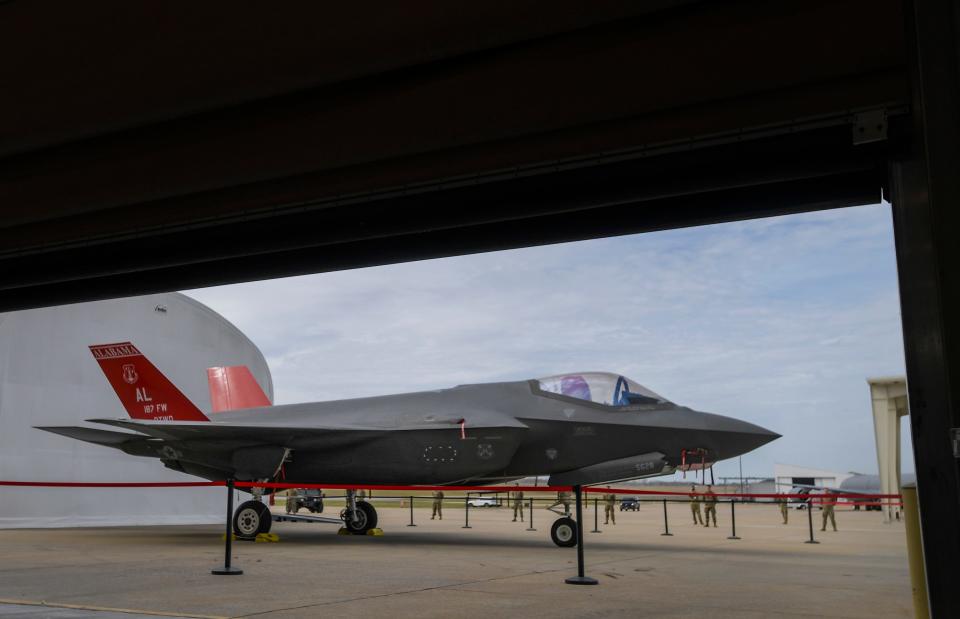 A hangar door is lifted to display an F-35A Lightning II during an Aircraft Arrival Ceremony at the 187th Fighter Wing at Dannelly Field in Montgomery, Ala., on Friday morning February 9, 2024.