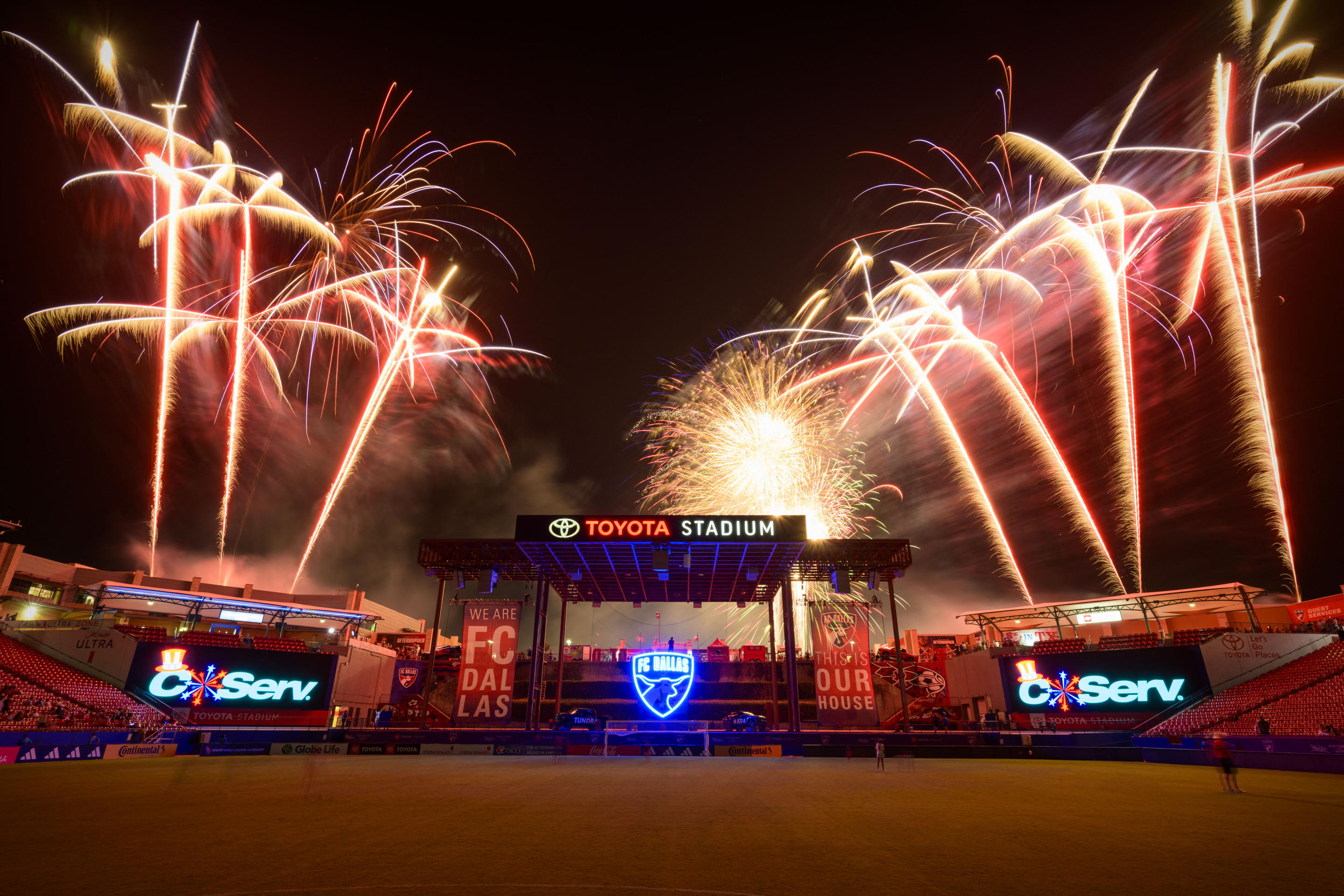 A view of the stadium and the field during a Fourth of July fireworks show.