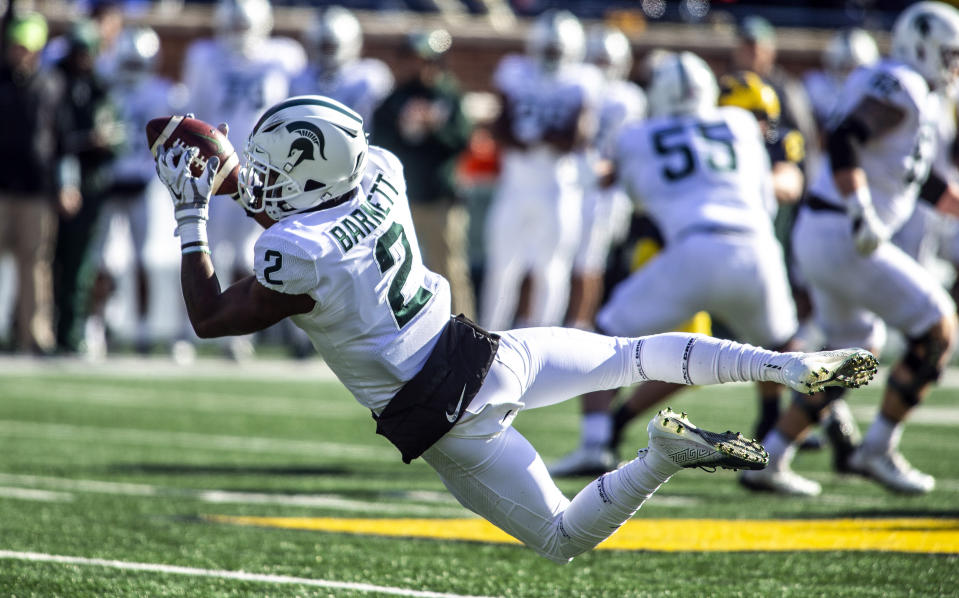 FILE - In this Nov. 16, 2019, file photo, Michigan State wide receiver Julian Barnett (2) makes a catch in the first quarter of an NCAA college football game against Michigan in Ann Arbor, Mich. Big Ten is going to give fall football a shot after all. Less than five weeks after pushing football and other fall sports to spring in the name of player safety during the pandemic, the conference changed course Wednesday, Sept. 16, 2020, and said it plans to begin its season the weekend of Oct. 23-24. (AP Photo/Tony Ding)