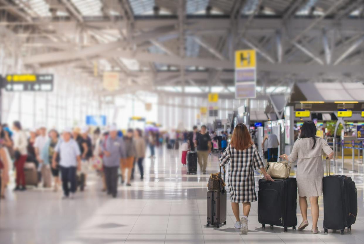 <a href="https://www.shutterstock.com/image-photo/woman-carries-luggage-airport-terminal-403443151" rel="nofollow noopener" target="_blank" data-ylk="slk:Shine Nucha/Shutterstock;elm:context_link;itc:0;sec:content-canvas" class="link ">Shine Nucha/Shutterstock</a>