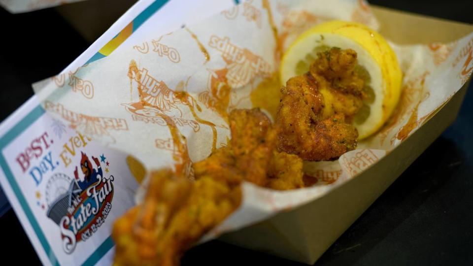 Oak City Fish & Chips Colossal Prawn Pop On a Stick, the media’s pick fore best news food offering at the 2023 North Carolina State Fair, during a tasting event on Oct. 9, 2023.