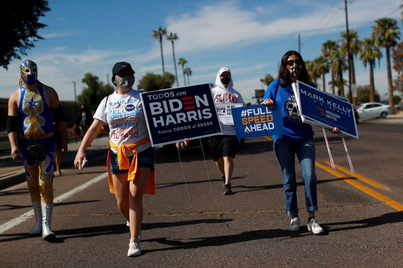 FILE PHOTO: People promote the importance of the Latino vote in Maryvale, Phoenix