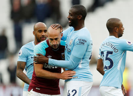 Soccer Football - Premier League - West Ham United v Manchester City - London Stadium, London, Britain - April 29, 2018 West Ham United's Pablo Zabaleta with Manchester City's Yaya Toure after the match Action Images via Reuters/John Sibley