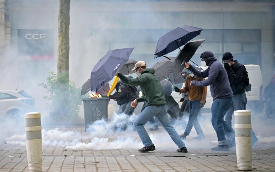 Tear gas is deployed in an attempt to control protesters