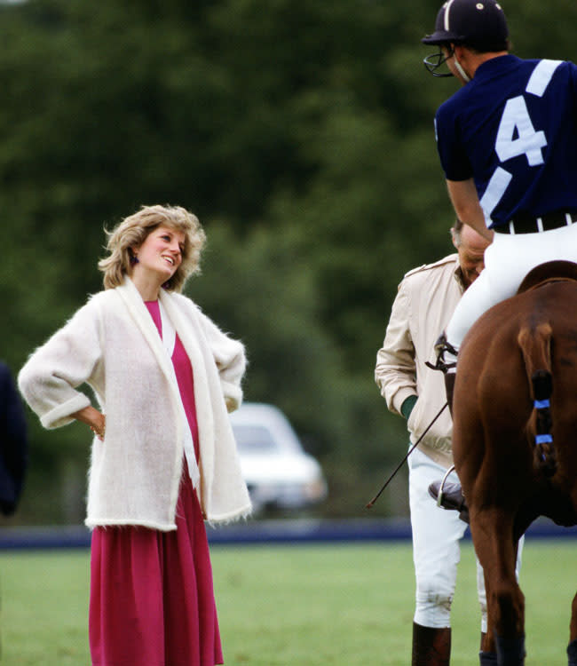 UNITED KINGDOM - JUNE 07, 1984: Diana, Princess of Wales talks to Prince Charles, Prince of Wales as he rides his polo horse at Guards Polo Club in Windsor (Photo by Tim Graham/Getty Images)