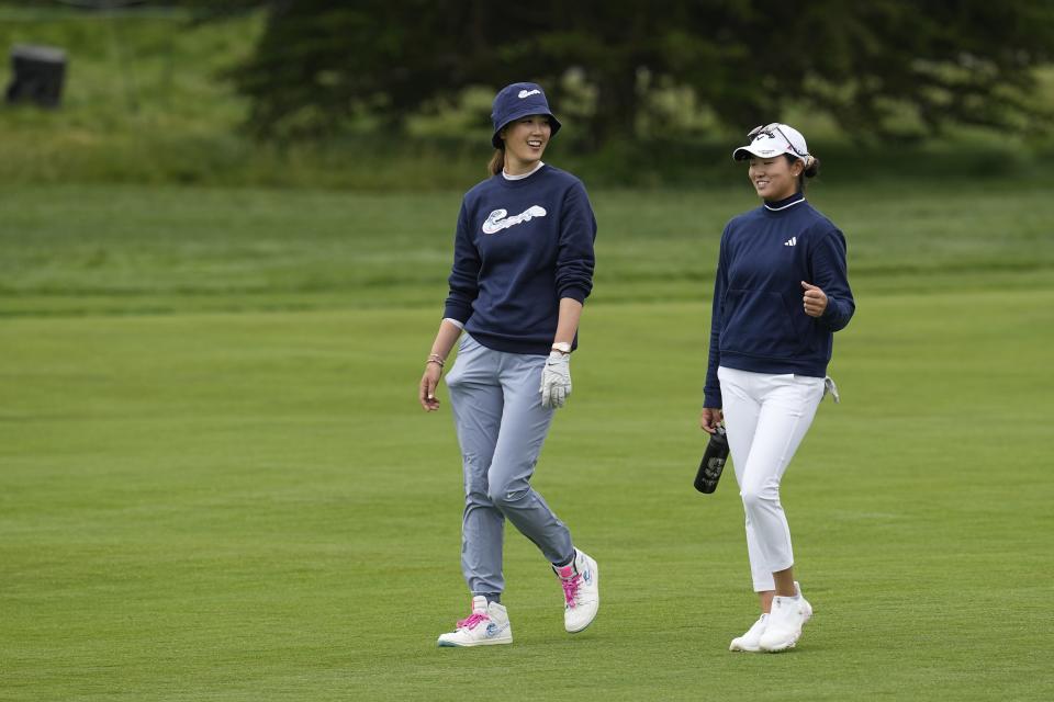 Michelle Wie West, left, and Rose Zhang walk down the sixth fairway during a practice round for the U.S. Women's Open golf tournament at Pebble Beach Golf Links, Tuesday, July 4, 2023, in Pebble Beach, Calif. (AP Photo/Darron Cummings)