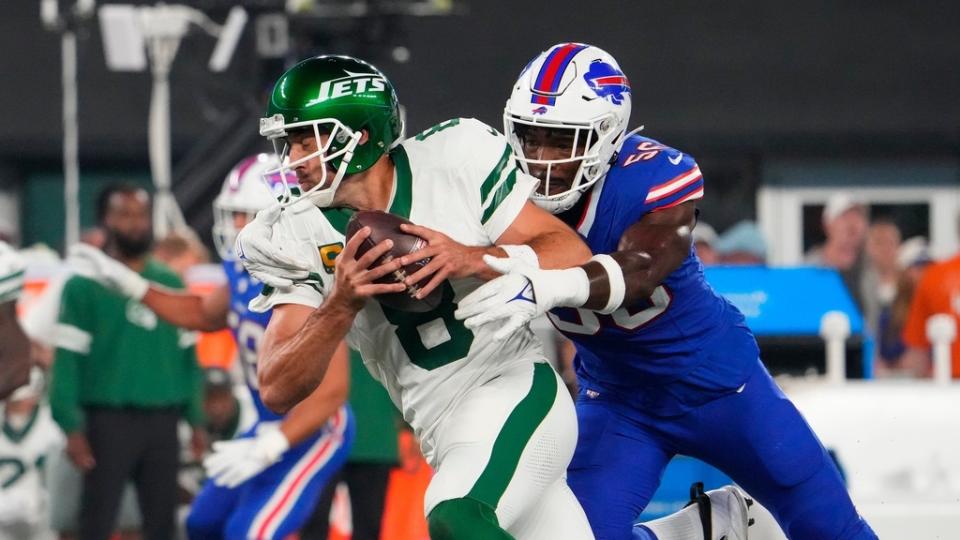 Buffalo Bills defensive end Leonard Floyd (56) sacks New York Jets quarterback Aaron Rodgers (8) during the first quarter at MetLife Stadium. Rogers left the game with an injury after the play.