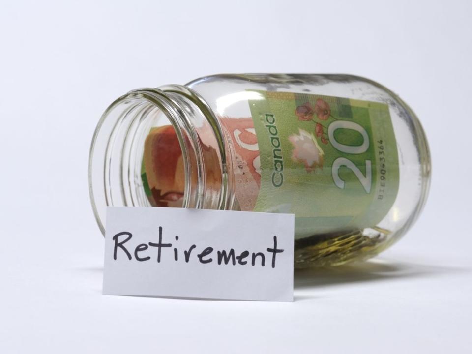 Retirement Savings Jar With Canadian Banknotes