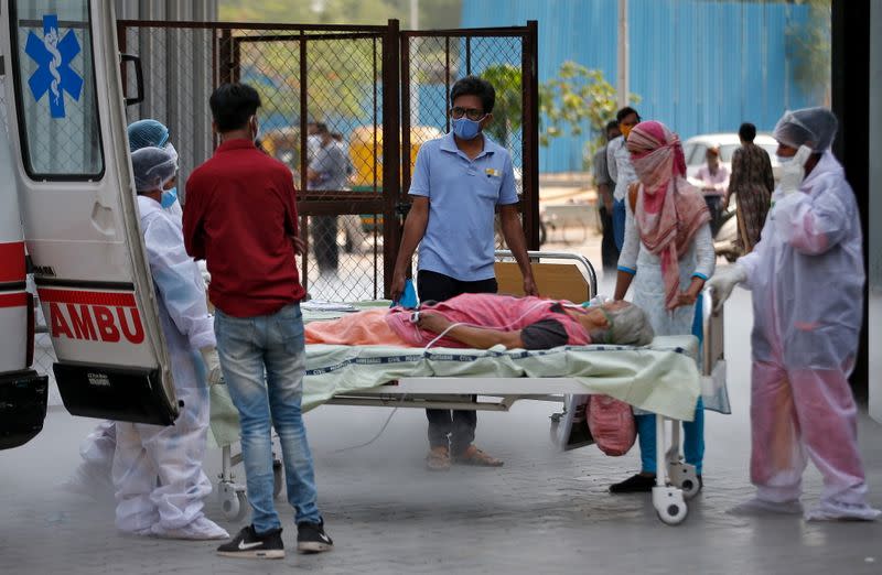 A patient lies in a bed as she is being shifted to a hospital for treatment, amidst the spread of the coronavirus disease (COVID-19) in Ahmedabad