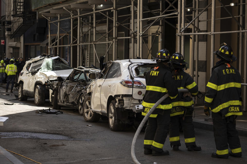 Cars are parked outside a partially collapsed parking garage in the Financial District of New York, Wednesday, April 19, 2023. (AP Photo/Yuki Iwamura)