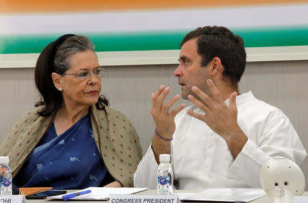 Rahul Gandhi, President of Congress party, speaks with his mother and leader of the party Sonia Gandhi during Congress Working Committee (CWC) meeting in New Delhi, India, May 25, 2019. REUTERS/Altaf Hussain